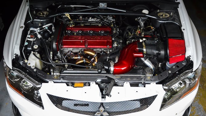 Aftermarket cold air intake system installed in a car engine bay with visible intake tube and filter