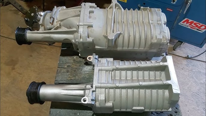 Why Superchargers Whine and Turbos Don't: The Sound of Forced Induction